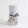 Rolled Blue Check Knitted Chenille Blanket beautifully packaged with a gray satin ribbon and a heart gift tag.