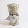 Rolled Taupe Sunflower Knitted Chenille Blanket tied elegantly with a gray satin ribbon and a heart-shaped gift tag.