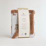 Folded Jersey Sherpa Blanket in Cuddly Bear style packaged neatly with a decorative cardboard product band for gifting.