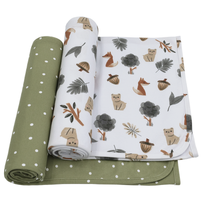Two-pack of baby jersey swaddle blankets featuring one white wrap printed with watercolor foxes, bears, acorns, and pine trees, and a second coordinating olive green wrap with a minimalist white polka dot pattern.