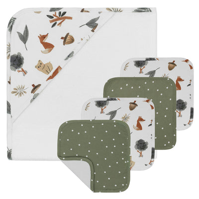 Product studio layout of the 5-piece Forest Retreat baby bath gift set, displaying a white hooded towel with a watercolor woodland animal print corner alongside four coordinating green and patterned washcloths.