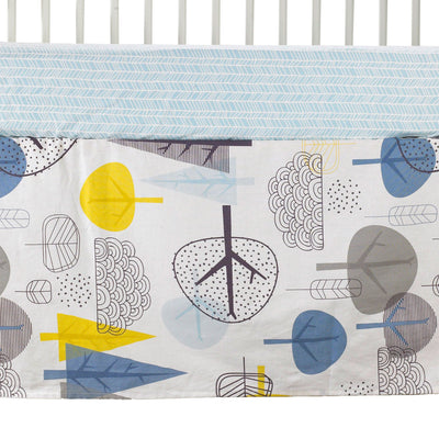 Close-up product shot of a tailored crib bed skirt featuring a modern