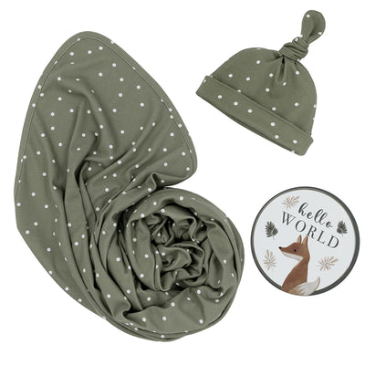 Hello World 3-piece newborn gift set in Olive Spots style, featuring a soft olive green jersey cotton swaddle blanket, a matching printed top-knot baby beanie, and a round fox-illustrated 