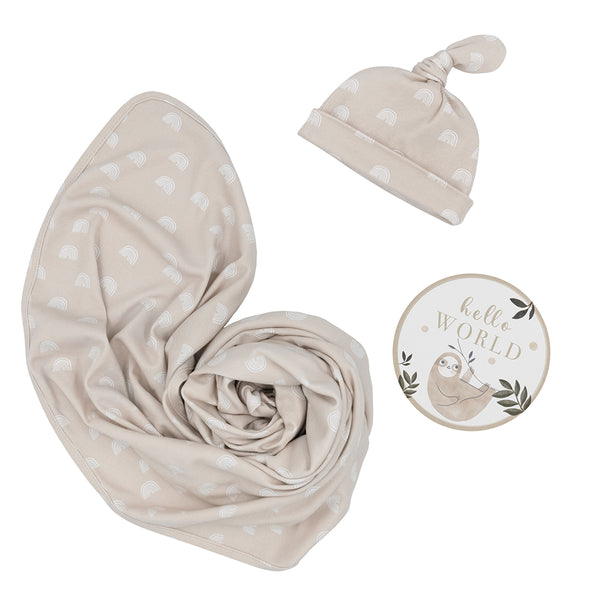 Hello World 3-piece newborn gift set in Rainbow style, featuring a soft taupe jersey cotton swaddle blanket, a matching printed top-knot baby beanie, and a round sloth-illustrated "Hello World" milestone announcement disc.