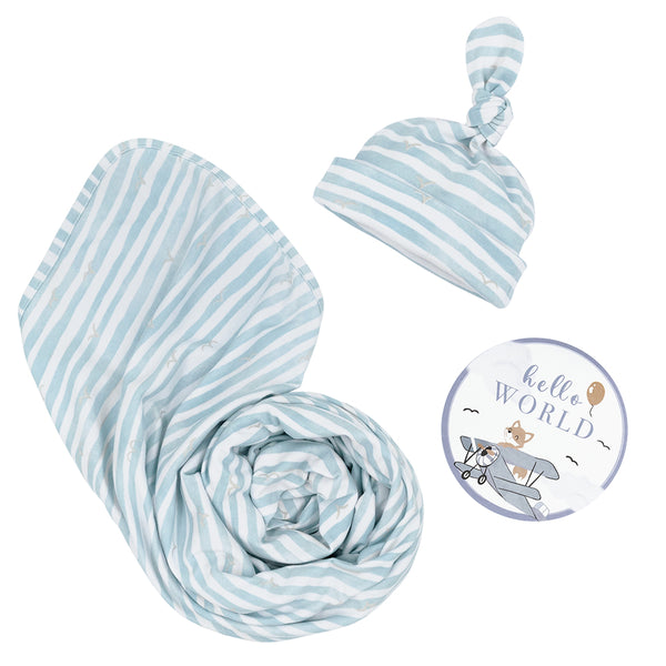 Hello World 3-piece newborn gift set in Blue Stripes, featuring a soft cotton jersey swaddle blanket, a matching striped knotted baby hat, and a round hot air balloon illustrated milestone announcement disc.