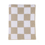 Flat lay view of the Knitted Chenille Blanket in Taupe Check, featuring a modern neutral taupe and white checkered pattern.