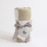 Rolled Taupe Check Knitted Chenille Blanket beautifully packaged with a gray satin ribbon and a heart-shaped gift tag.