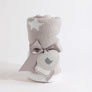 Rolled Knitted Chenille Blanket in Grey Galaxy, wrapped neatly with a light grey ribbon and a heart-shaped gift tag on a plain background.