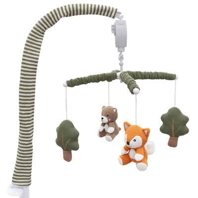 Studio product shot of the complete Forest Retreat musical crib mobile showcasing the full hanging assembly with knitted foxes, bears, and pine trees under a fabric sleeve.